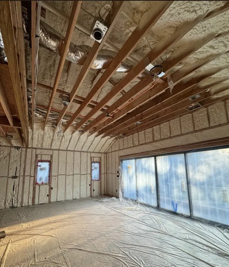 Interior walls and ceiling insulated with spray foam during new construction in Penfield